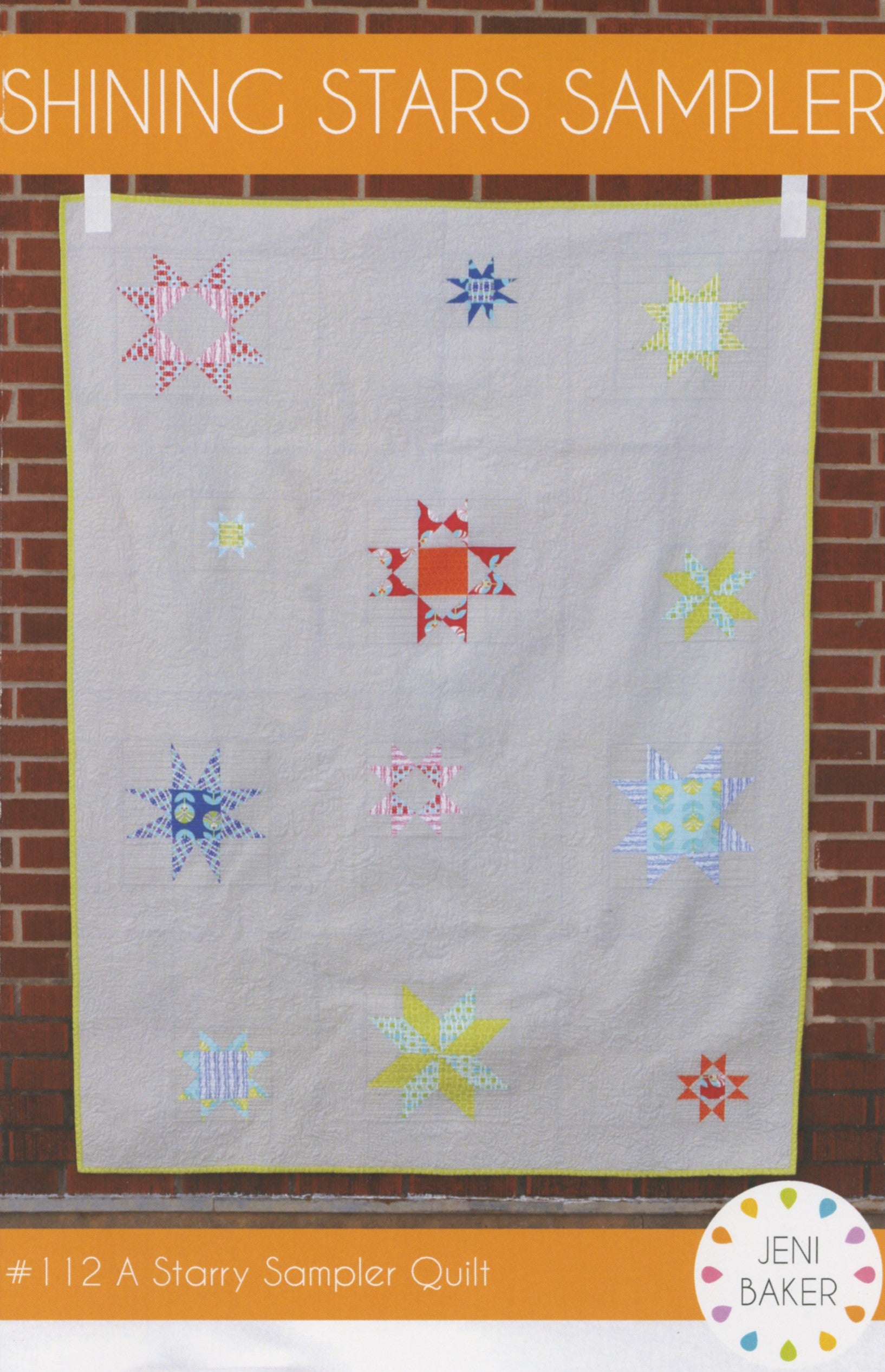Shining Stars Sampler quilt pattern by Jeni Baker, scattered star blocks on a grey background